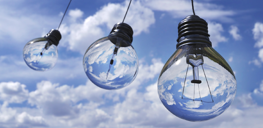 lightbulbs with blue sky and clouds background